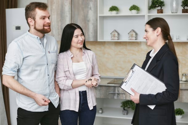  a-landlord-speaking-with-two-prospective-tenants