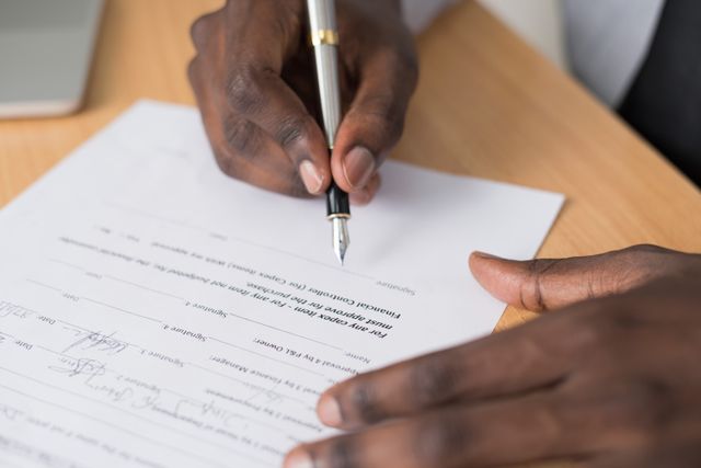 hand signing a document