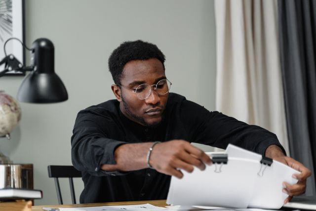 person at a desk reviewing documents