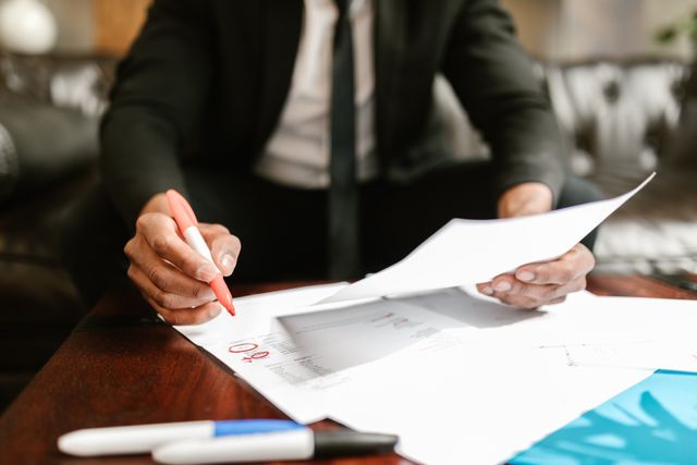 person reviewing documents at a desk